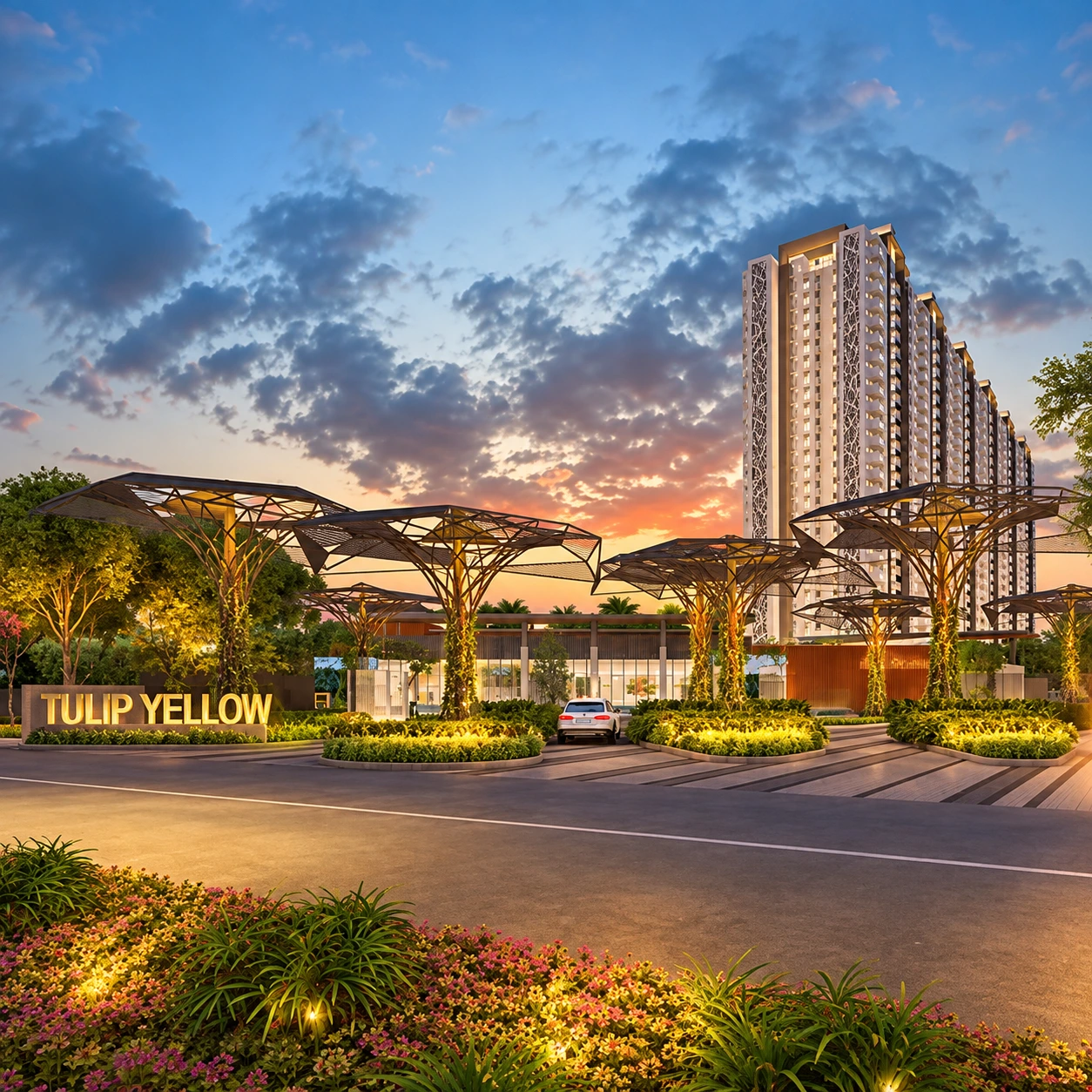 Stunning sunset view of the Tulip Yellow residential complex entrance, featuring unique tree-like canopy structures and a modern high-rise tower in Sector 69, Gurgaon.
